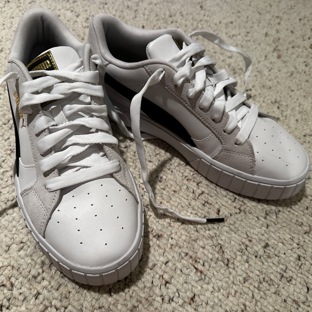 White Puma sneakers Size 10 with black strip and gold accent
